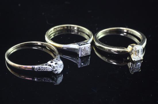 Two 18ct gold and solitaire diamond rings and a single stone diamond ring with diamond set shoulders, sizes N,P & Q.